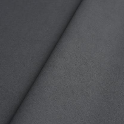 Dark and medium grey vegan leather panels with a diagonal seam and soft matte texture for upholstery or apparel.