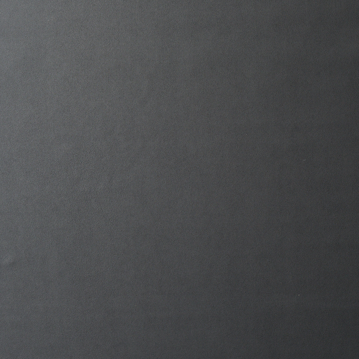 Dark gray textured slate-like background with subtle grain.