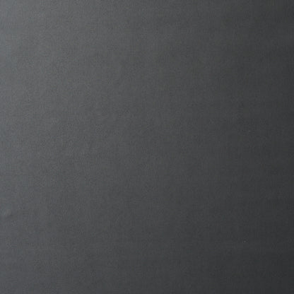 Dark gray textured slate-like background with subtle grain.
