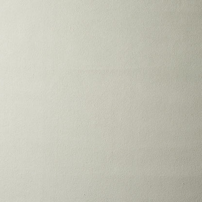 Cream-beige textured wall surface with subtle grain.