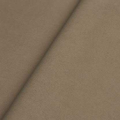 Tan suede fabric roll with a diagonal fold, soft nap and matte finish.