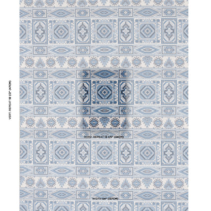 Blue & white geometric pattern on woven velvet fabric, featuring repeating square medallions & ornate borders.