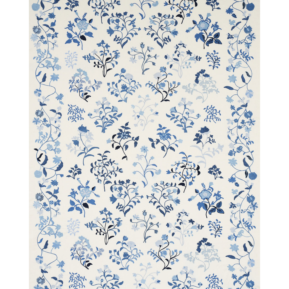 Cream wallpaper with scattered blue botanical florals and vines in varying blue shades.