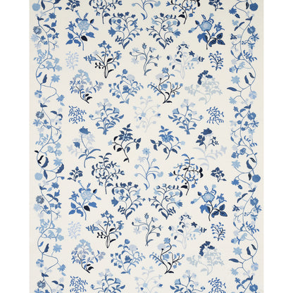 Cream wallpaper with scattered blue botanical florals and vines in varying blue shades.