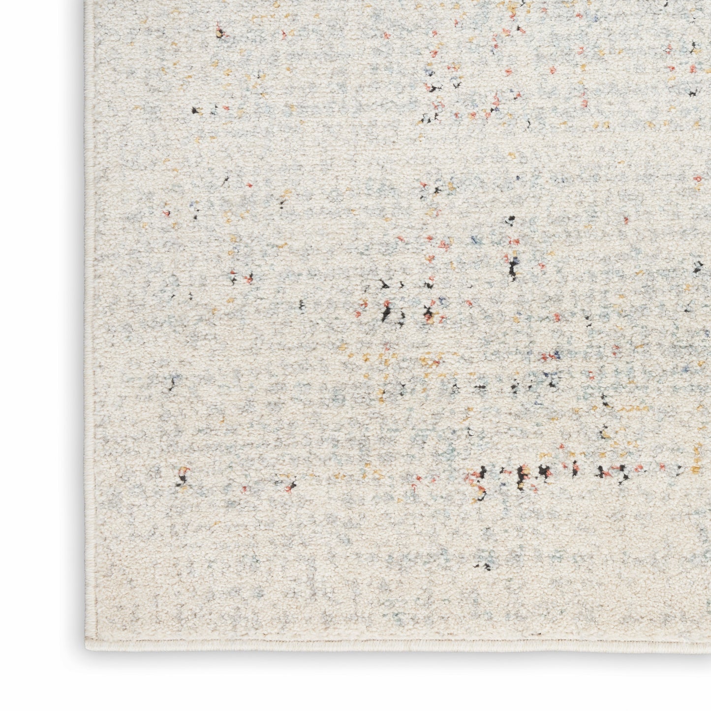 Cream textured rug with multicolor flecks in red, blue, yellow, black; rectangular woven floor decor for interiors