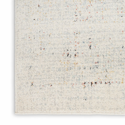 Cream textured rug with multicolor flecks in red, blue, yellow, black; rectangular woven floor decor for interiors