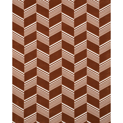 Brown cut velvet fabric with a white diagonal striped chevron pattern creating vertical zigzags; bold geometric textile.