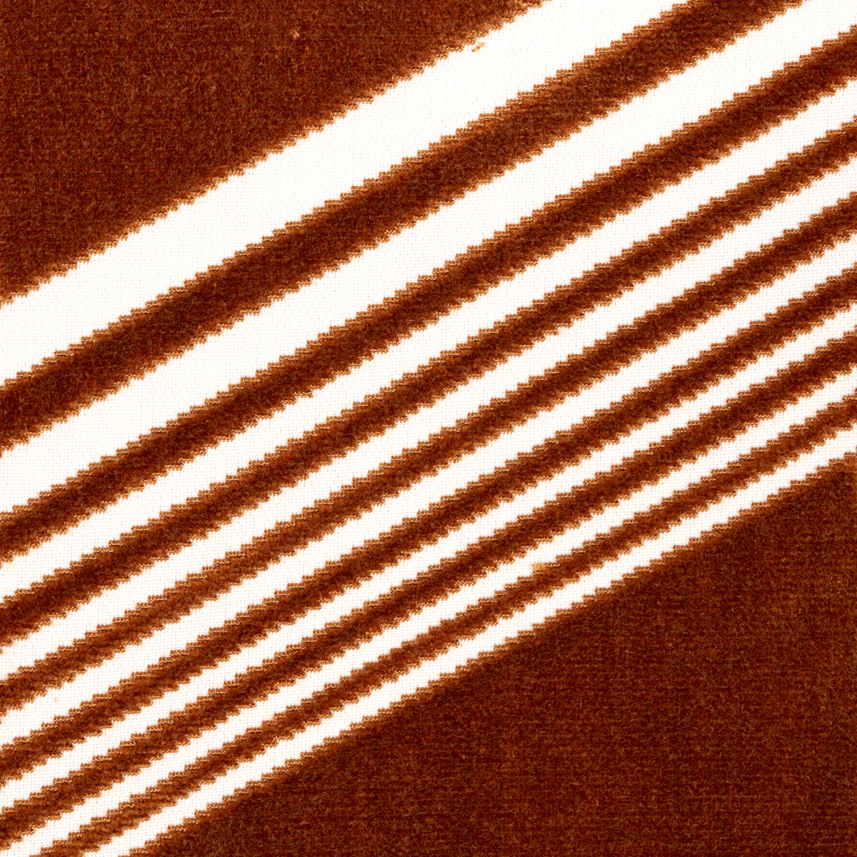 Camel-colored cut velvet fabric with diagonal white stripes forming a bold geometric pattern.