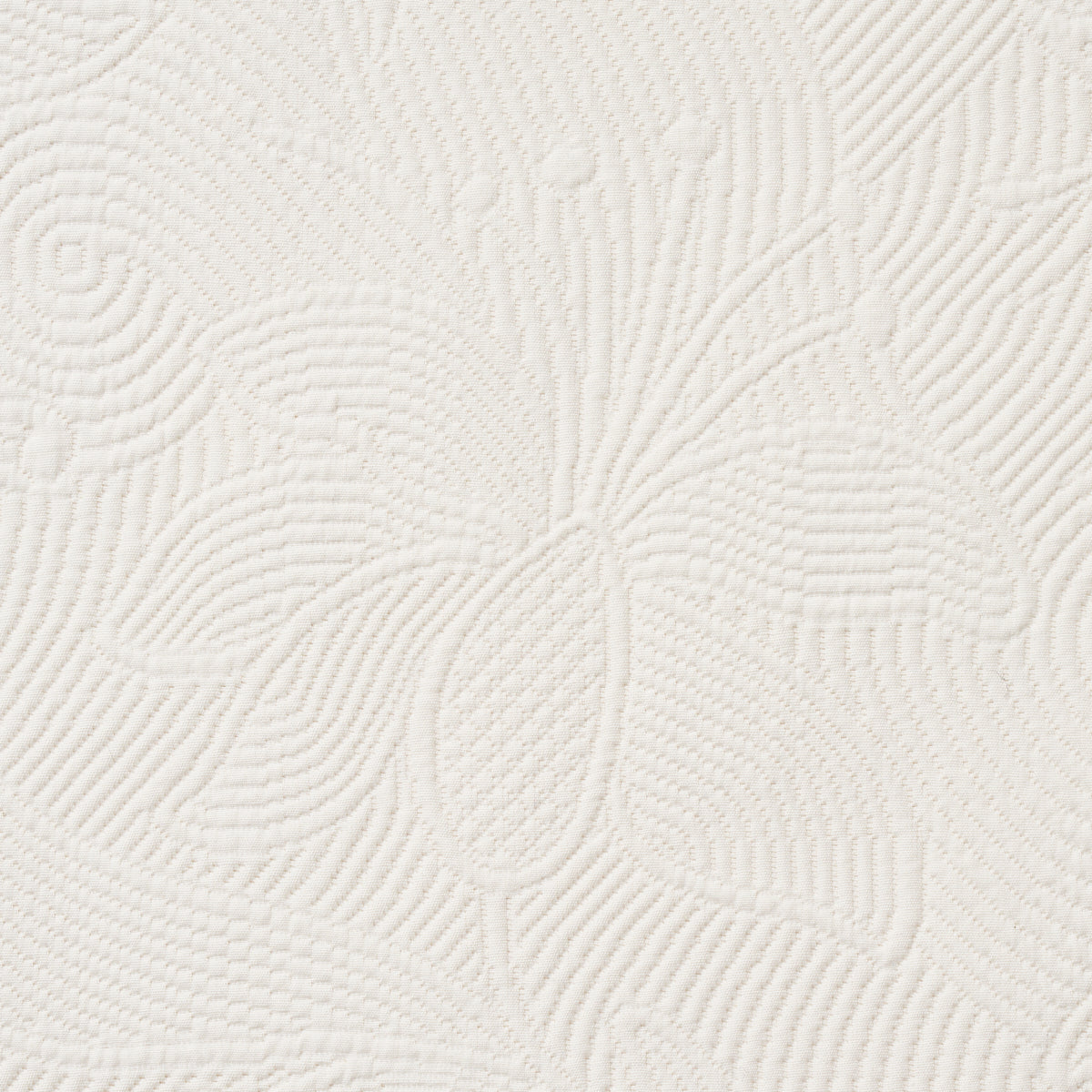 Cream textured fabric with raised floral leaf motif and a quilted look; ideal for upholstery.