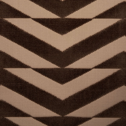 Tan and brown chevron rug pattern in a woven textile with bold zigzags.