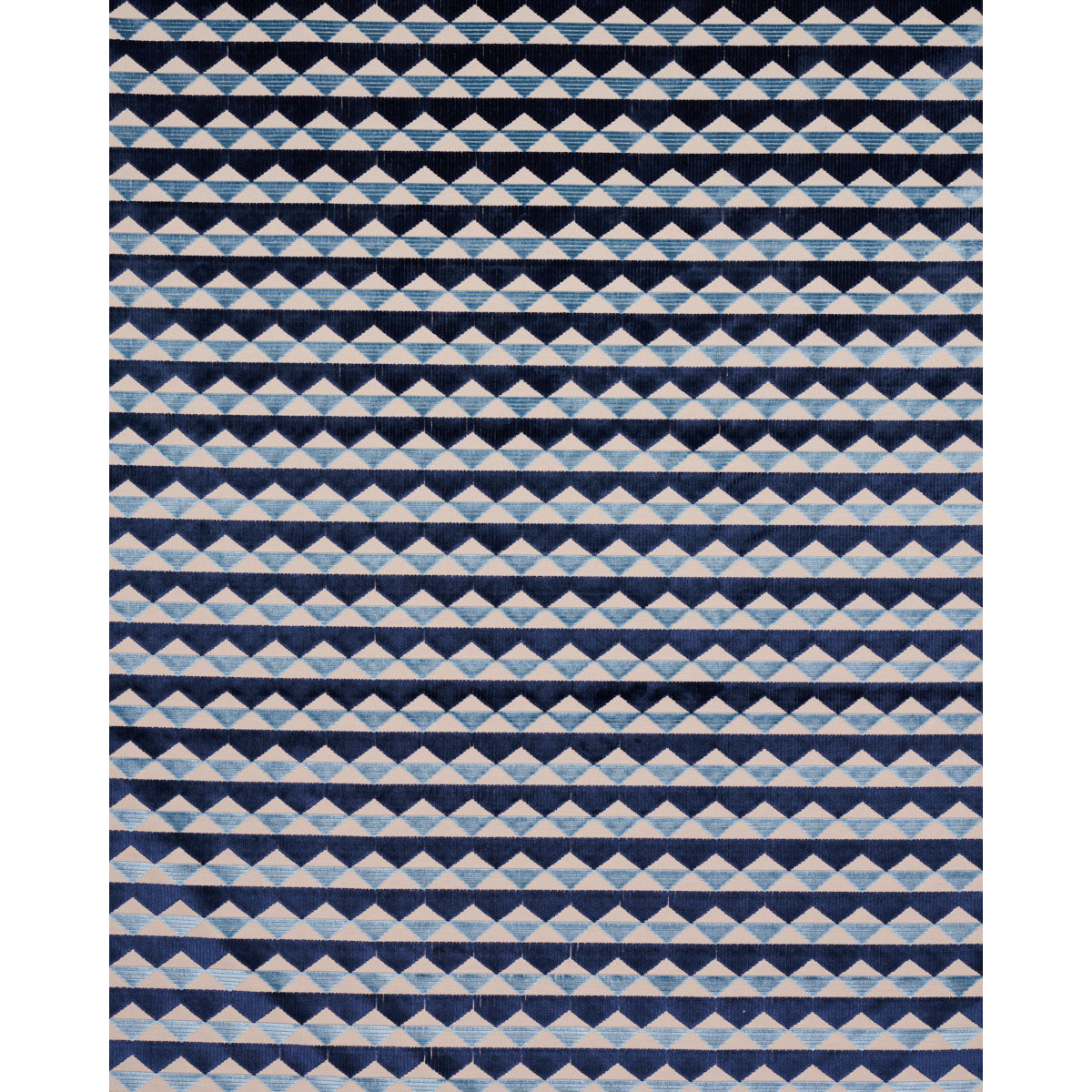 Geometric rug featuring repeating white and light blue triangles in diamond stripe pattern on navy background.