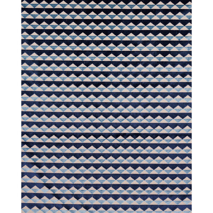 Geometric rug featuring repeating white and light blue triangles in diamond stripe pattern on navy background.