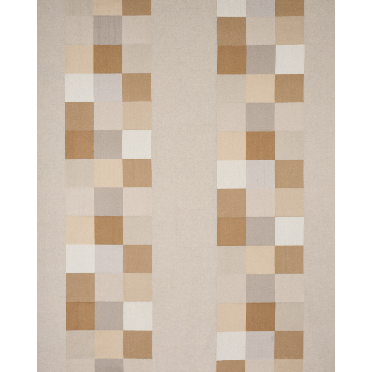 Neutral area rug featuring two vertical columns of tan, beige, ivory squares on a soft beige field.