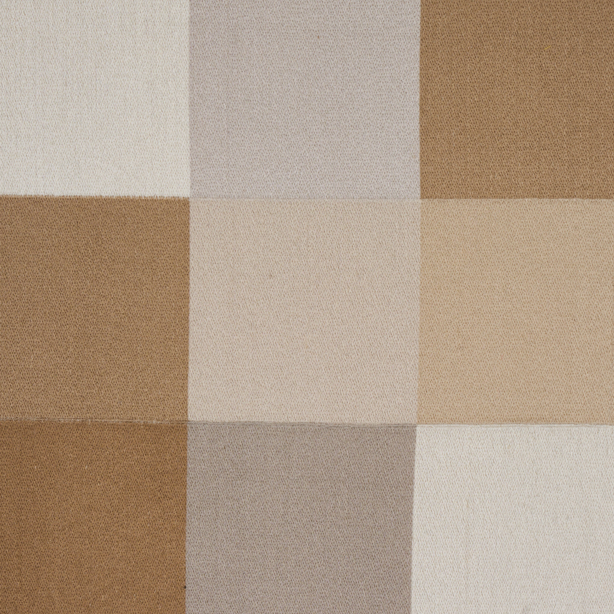 Neutral patchwork fabric with square blocks in cream, beige, taupe and brown tones.