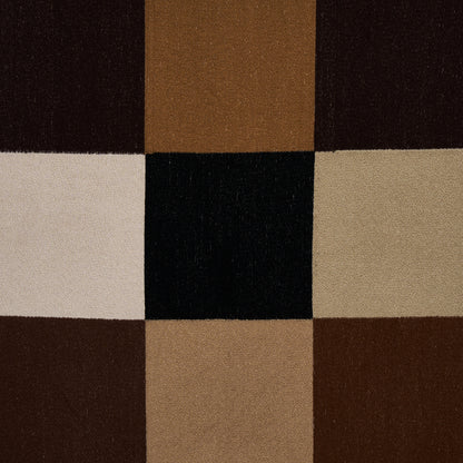 3x3 patchwork textile of brown, tan, beige, cream and black squares; geometric rug or upholstery fabric.