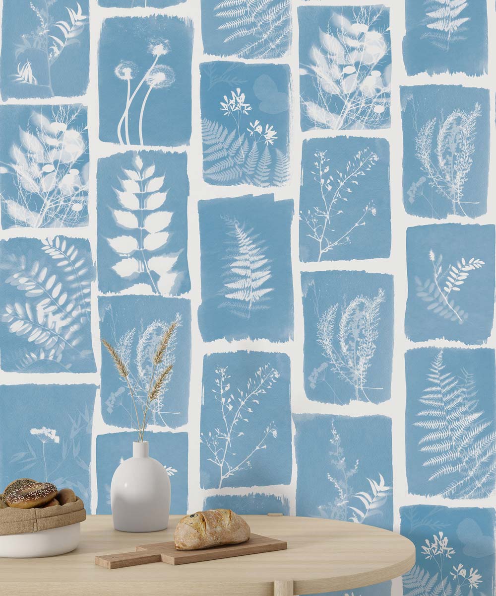 Blue botanical wall mural with a leafy pattern.