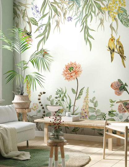 Tropical botanical wall mural with green leaves, pink flowers & yellow birds, in a bright room with wooden furniture.