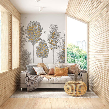 Bright wood-paneled living room with gray sofa, orange cushions, round wicker table, tree mural, large window view.