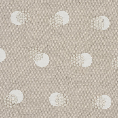 Beige woven fabric with repeating white polka-dots, each dot featuring a raised beaded texture.