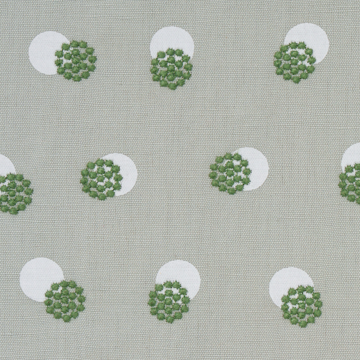 Beige linen-like fabric with white circles & green floral rosettes; retro botanical print for upholstery.