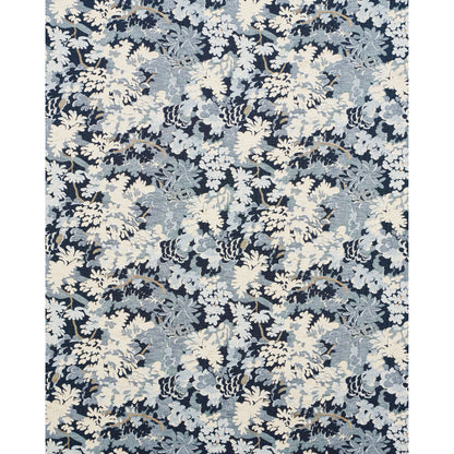Navy fabric with cream and pale blue leafy floral pattern; tropical botanical print suitable for upholstery or curtains.
