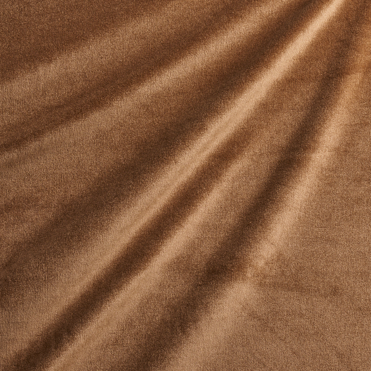 Brown soft fabric with diagonal drape and velvety suede-like texture.