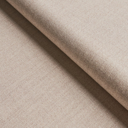 Beige woven fabric with a folded edge; linen-like texture, soft neutral material for upholstery or garments.