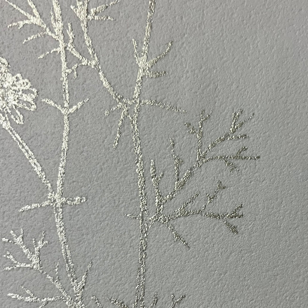 Silver metallic botanical wallpaper — hand‑drawn sketch foliage motif, luminous finish, non‑woven paste‑the‑wall for easy installation and removal, ideal for accent walls in elegant interiors