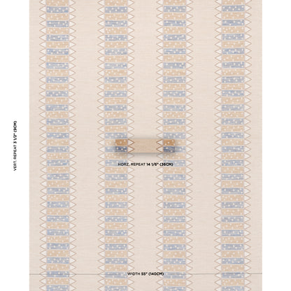 Beige flat-weave rug with vertical blue geometric blocks and triangle motifs; modern southwestern style.