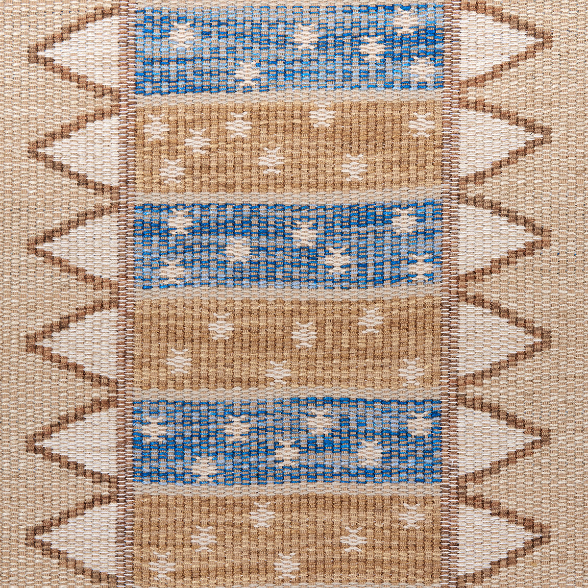 Woven kilim rug with alternating blue and tan horizontal bands, white diamond motifs, chevron side border.