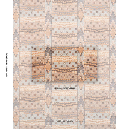 Geometric rug in peach, beige & gray with diamond and stripe motifs and repeating rectangles.