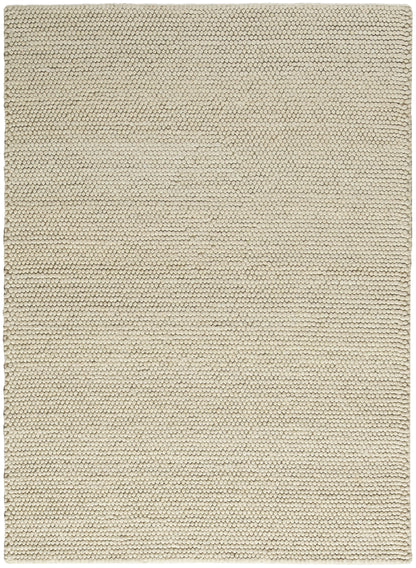 Beige textured rug close-up with tight loop pile; rectangular, minimalist home decor.