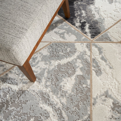 Light gray modern area rug with a gray-beige pattern.