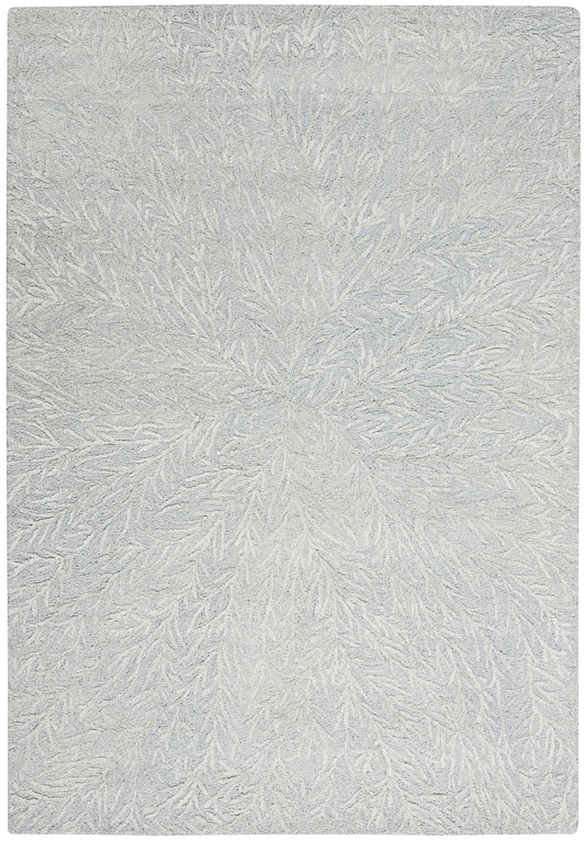 Rectangular light gray textured rug with plush pile and radiating leaf-like pattern.