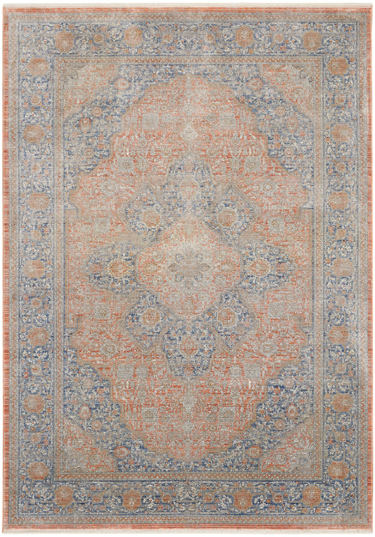 Persian-style area rug in coral and blue, with central medallion and ornate floral border, distressed vintage look.