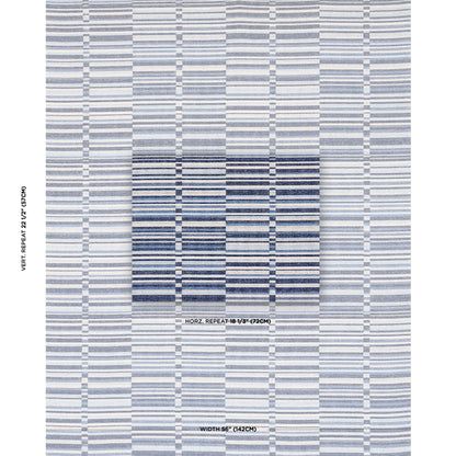 Blue striped woven textile with a darker blue central square; pale blue and white horizontal bands form a geometric rug-like pattern.