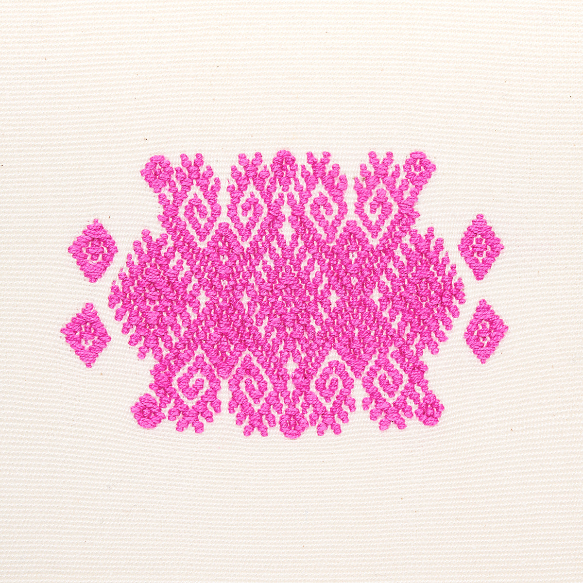 Bright pink embroidered damask-style motif on light fabric, ornate geometric floral pattern.