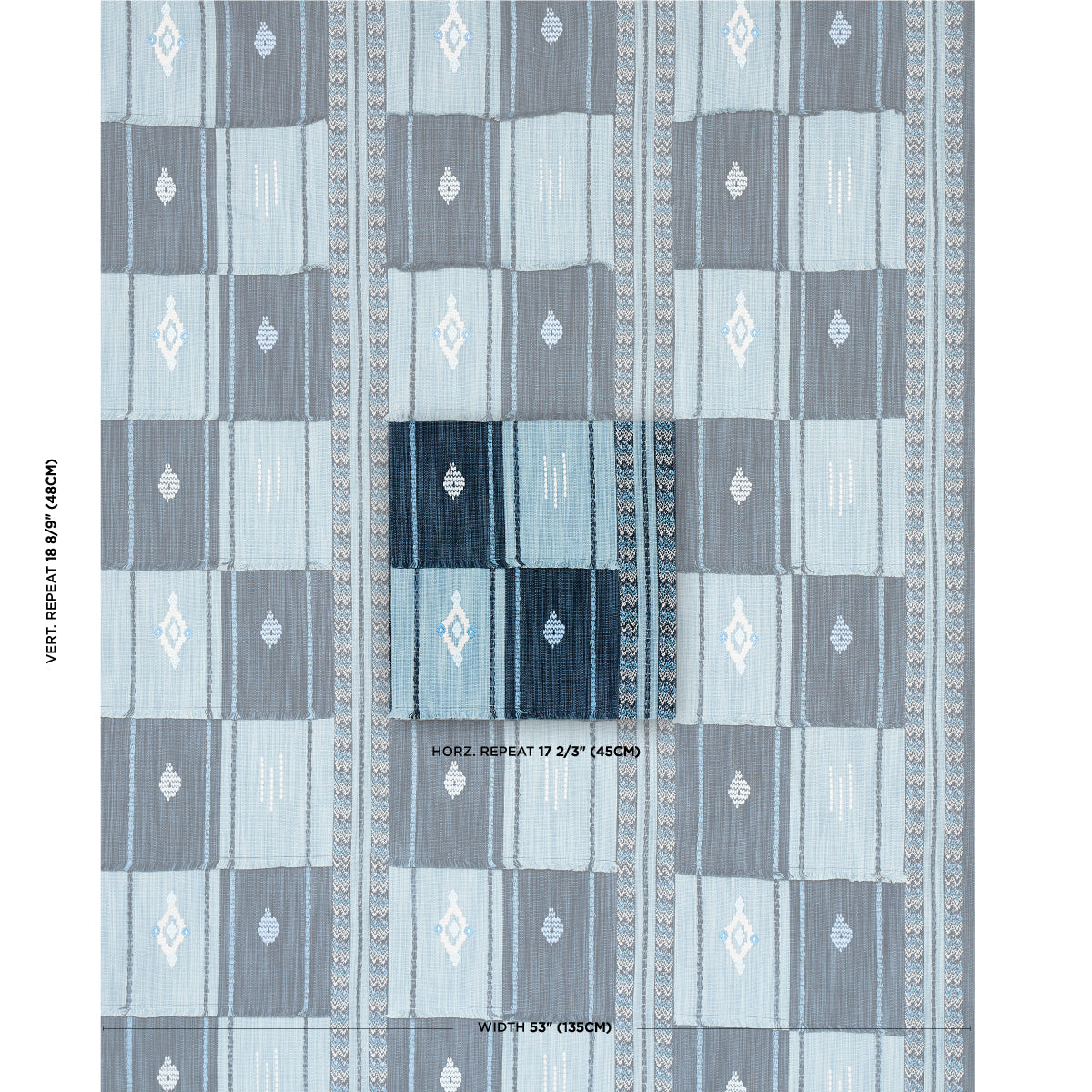 Blue geometric quilted textile with alternating light/dark blue squares and diamond motifs; decorative rug or throw.