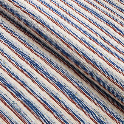 Woven textile with narrow blue and brown stripes on white, diagonally folded for texture.