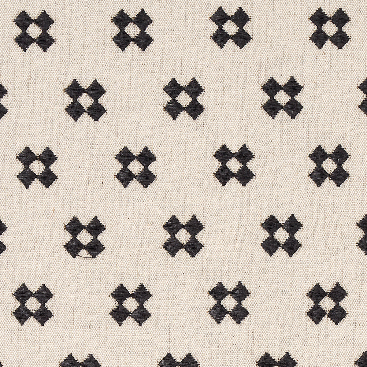 Cream natural fabric with repeating black X-shaped embroidery motifs forming a geometric grid.