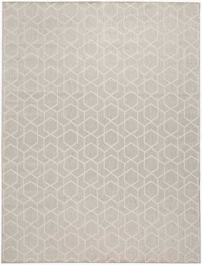 Beige textured area rug with an interconnected hexagon geometric pattern; neutral, modern living room rug.