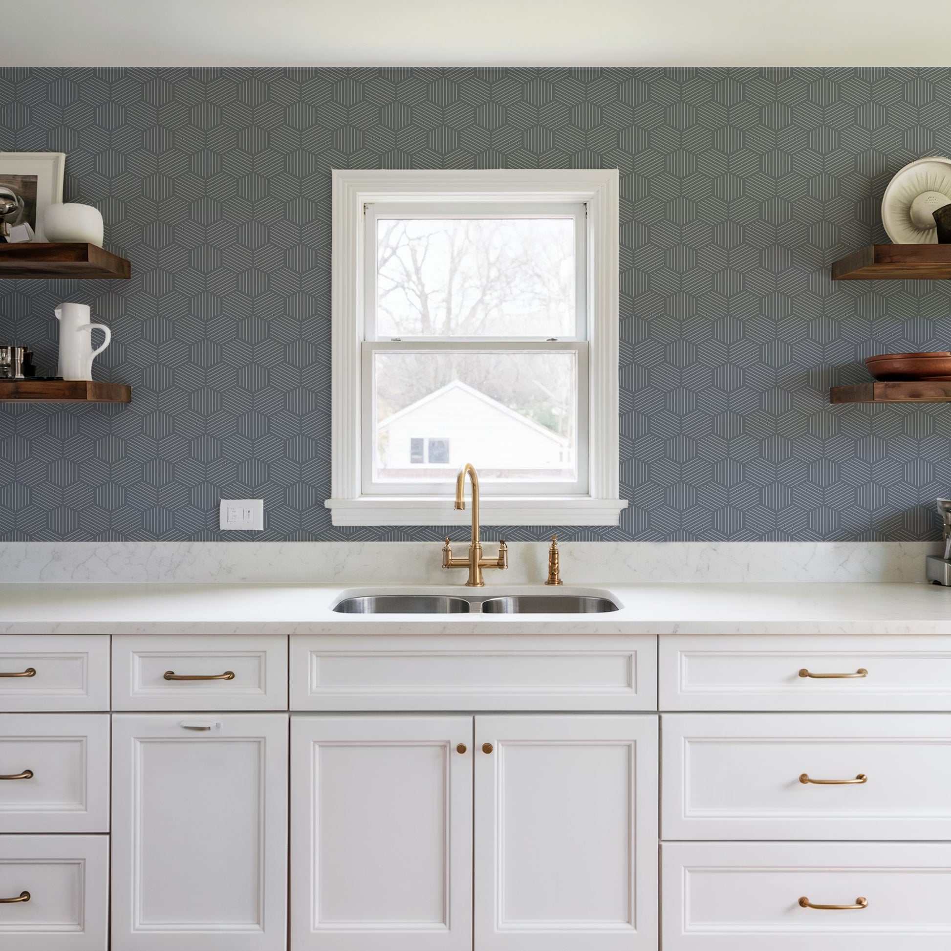 Blue striped hexagonal mosaic peel-and-stick wallpaper on wall; abstract modern blue pattern.