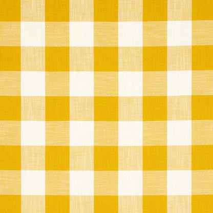 Yellow and white gingham check fabric, cotton textile with square pattern for tablecloths or apparel.