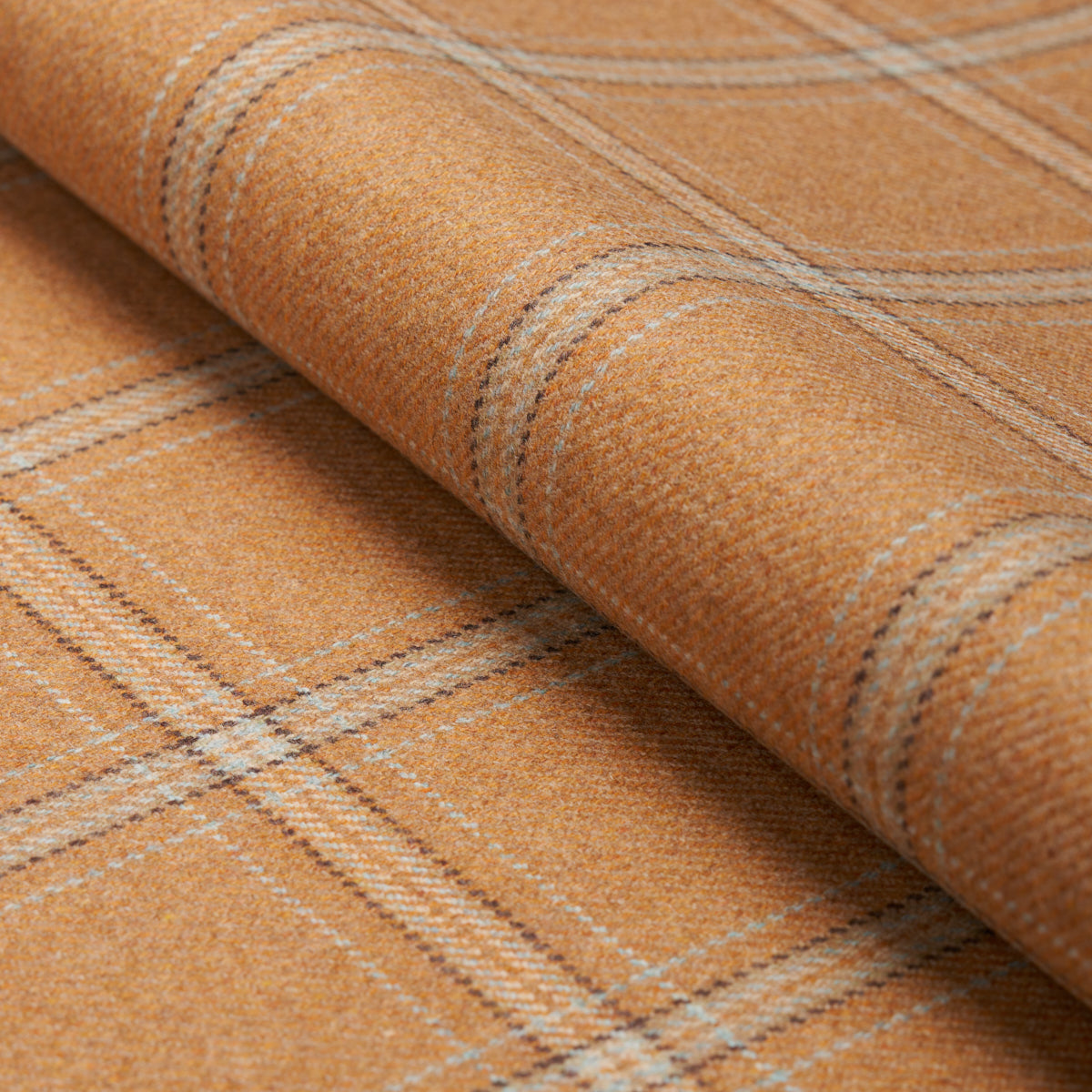 Orange wool plaid fabric rolled at the edge with beige stripes in a soft textured weave.