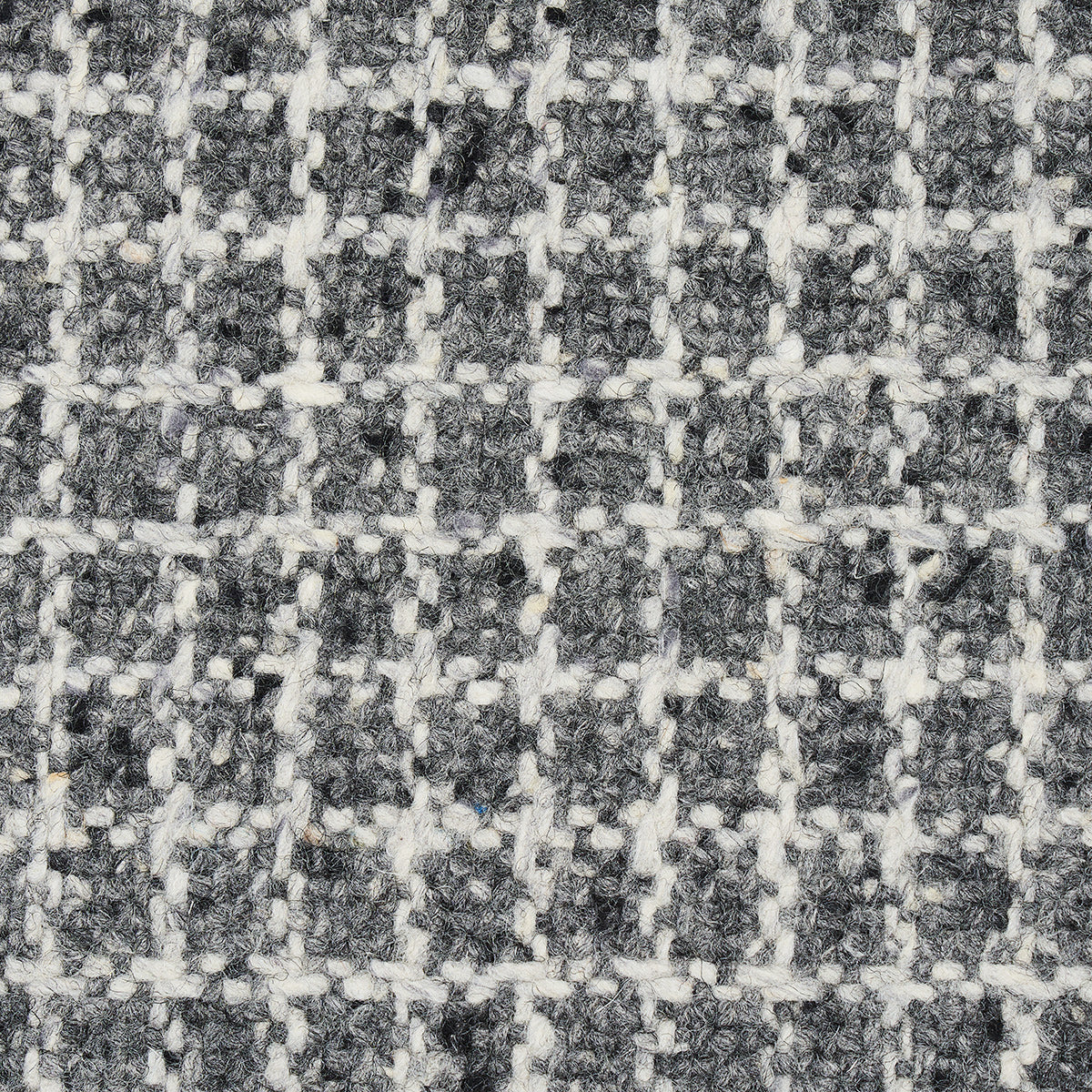 Close-up of gray & white woven tweed fabric with a subtle checkered grid.