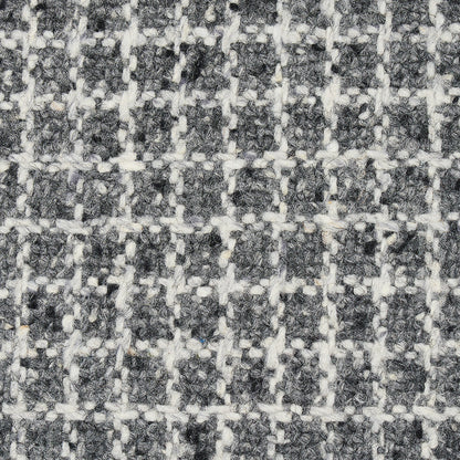 Close-up of gray & white woven tweed fabric with a subtle checkered grid.
