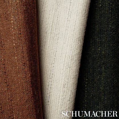 Three woven fabric bolts in ivory with brown and dark green accents; textured tweed-style upholstery fabric.