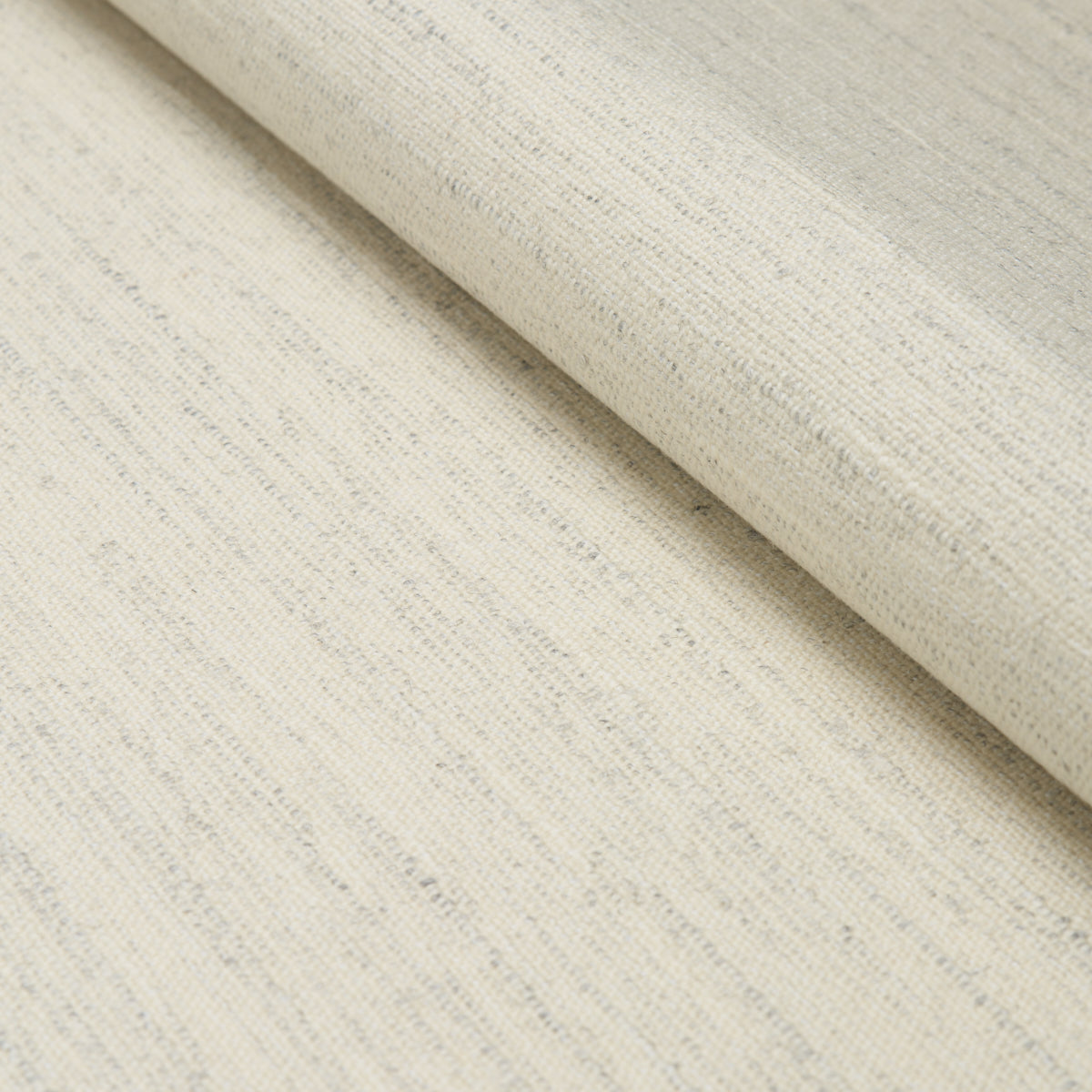 Creamy off-white textured woven fabric roll with subtle slub pattern, linen-like material.