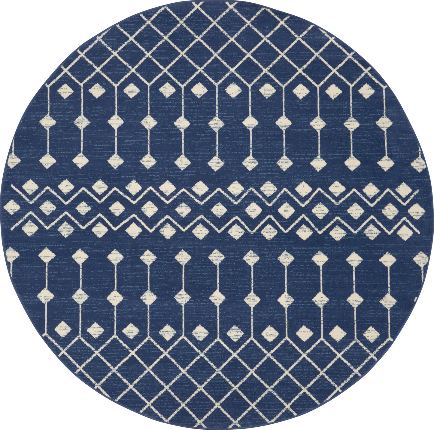 Round navy blue rug with white geometric lattice and diamond motifs in horizontal bands.
