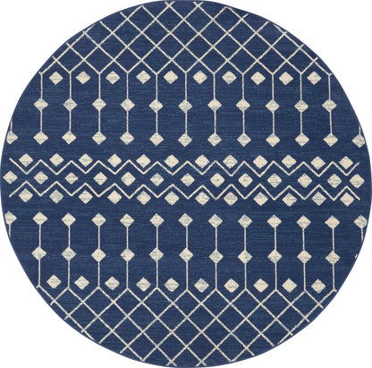 Round navy blue rug with white geometric lattice and diamond motifs in horizontal bands.